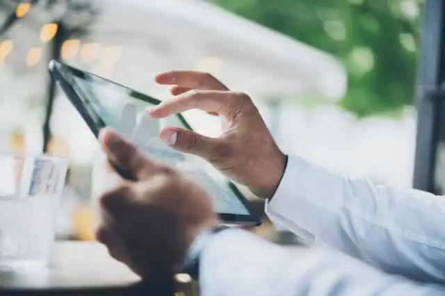 man-looking-at-tablet-for-information