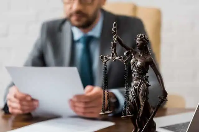 man reviewing legal document medium