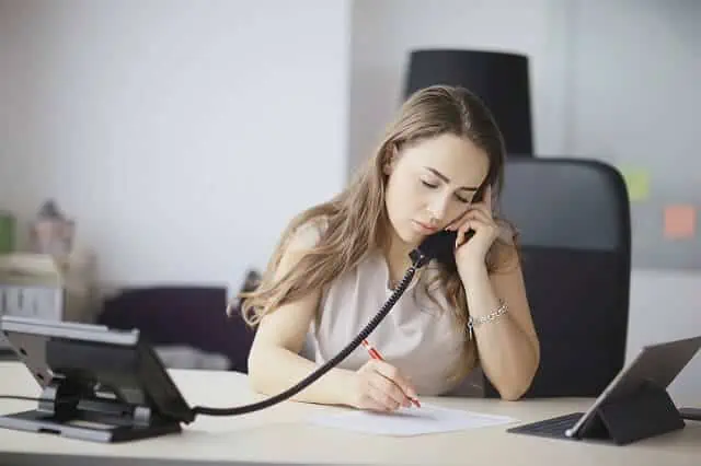woman on phone and red pen
